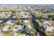 Aerial view of canal-front property with a single story home at 3004 Banyan Way, Punta Gorda, FL 33950