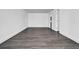 Bright bedroom with gray vinyl plank flooring and neutral walls, featuring ample space at 3004 Banyan Way, Punta Gorda, FL 33950