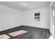 Bright bedroom featuring gray flooring and a window offering natural light at 3004 Banyan Way, Punta Gorda, FL 33950