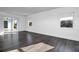 Light and airy bedroom with gray flooring and sliding glass doors opening to a patio at 3004 Banyan Way, Punta Gorda, FL 33950