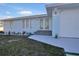 Light blue single story home with modern front entrance at 3004 Banyan Way, Punta Gorda, FL 33950