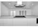 Modern kitchen with white cabinets and quartz countertops at 3004 Banyan Way, Punta Gorda, FL 33950