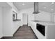 Modern kitchen with white cabinets and white quartz countertops at 3004 Banyan Way, Punta Gorda, FL 33950