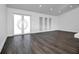 Spacious living room with large windows and double doors at 3004 Banyan Way, Punta Gorda, FL 33950
