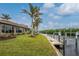 Backyard oasis with a private dock, waterfront views, and lush landscaping at 3310 Tripoli Blvd, Punta Gorda, FL 33950