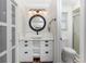 Bright bathroom with white vanity, vessel sink, and decorative tiled floor at 3310 Tripoli Blvd, Punta Gorda, FL 33950