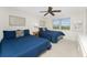 Guest bedroom with two twin beds, ceiling fan, and natural light at 3310 Tripoli Blvd, Punta Gorda, FL 33950