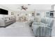 Spacious living room with comfortable seating, ceiling fan, and access to other living areas at 3310 Tripoli Blvd, Punta Gorda, FL 33950