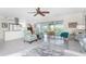 Living room with ceiling fan, comfortable seating, and sliding glass doors to the patio at 3310 Tripoli Blvd, Punta Gorda, FL 33950