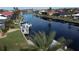Bird's eye view of waterfront property with canal access and boat dock at 3448 Nighthawk Ct, Punta Gorda, FL 33950