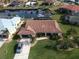 Stunning waterfront home with tile roof, lush landscaping, and boat access to the canal at 3448 Nighthawk Ct, Punta Gorda, FL 33950