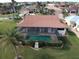 Property features a screened-in pool and patio area with lush landscaping at 3448 Nighthawk Ct, Punta Gorda, FL 33950