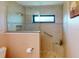 Walk-in shower with tiled walls and pebble flooring at 3448 Nighthawk Ct, Punta Gorda, FL 33950