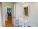 Bathroom with pedestal sink and view of bedroom at 3448 Nighthawk Ct, Punta Gorda, FL 33950