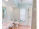 Clean bathroom with a single sink vanity, toilet, and a shower/tub combo at 3448 Nighthawk Ct, Punta Gorda, FL 33950