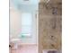 Bathroom with tile shower/tub combo and updated fixtures at 3448 Nighthawk Ct, Punta Gorda, FL 33950