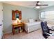 Bedroom with daybed, desk and ceiling fan at 3448 Nighthawk Ct, Punta Gorda, FL 33950