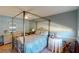 Bedroom with four-poster bed and ceiling fan at 3448 Nighthawk Ct, Punta Gorda, FL 33950
