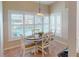 Bright breakfast nook with pool view and white table at 3448 Nighthawk Ct, Punta Gorda, FL 33950