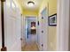 Clean hallway with light walls and doors leading to bedrooms and other rooms at 3448 Nighthawk Ct, Punta Gorda, FL 33950