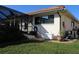 Rear view of house showing pool equipment and a fenced patio area at 3448 Nighthawk Ct, Punta Gorda, FL 33950