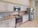 Modern kitchen with stainless steel appliances and granite countertops at 3448 Nighthawk Ct, Punta Gorda, FL 33950