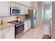 Modern kitchen with stainless steel appliances and granite countertops at 3448 Nighthawk Ct, Punta Gorda, FL 33950