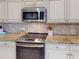 Modern kitchen with stainless steel appliances and granite countertops at 3448 Nighthawk Ct, Punta Gorda, FL 33950