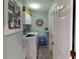 Laundry room with washer, dryer, and extra storage at 3448 Nighthawk Ct, Punta Gorda, FL 33950