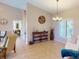 Spacious living area with tasteful decor and a large window with plantation shutters at 3448 Nighthawk Ct, Punta Gorda, FL 33950