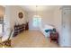 Living room features neutral colors, tile flooring, and a window with shutters at 3448 Nighthawk Ct, Punta Gorda, FL 33950