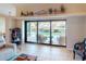 Living room with sliding glass doors offering stunning pool and canal views at 3448 Nighthawk Ct, Punta Gorda, FL 33950