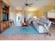 Bright and airy living room with neutral color palette, and access to kitchen at 3448 Nighthawk Ct, Punta Gorda, FL 33950