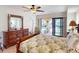 Main bedroom with pool access and king-size bed at 3448 Nighthawk Ct, Punta Gorda, FL 33950