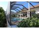 Inviting screened-in pool area, perfect for relaxation and entertainment at 3448 Nighthawk Ct, Punta Gorda, FL 33950