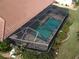 Screened-in rectangular pool with patio area at 3448 Nighthawk Ct, Punta Gorda, FL 33950