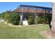 Screened pool with lush green landscaping and privacy hedges at 3448 Nighthawk Ct, Punta Gorda, FL 33950