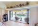 Spacious living area with sliding glass doors revealing a view of the refreshing pool at 3448 Nighthawk Ct, Punta Gorda, FL 33950