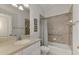 Bathroom with tub and shower combination, featuring neutral tones at 5463 Shagbark Ct, North Port, FL 34287