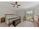 Spacious main bedroom with king-size bed and ample natural light at 5463 Shagbark Ct, North Port, FL 34287