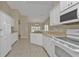 Kitchen with white cabinets and built in microwave at 7146 Sablon Rd, North Port, FL 34291