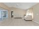 Bright living room with tile floors and sliding glass doors leading to the patio at 7146 Sablon Rd, North Port, FL 34291