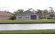 House with screened patio overlooking a canal at 7833 Mikasa Dr, Punta Gorda, FL 33950