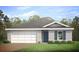 Single-story home with a two-car garage and landscaped lawn at 860 Chevy Chase St, Port Charlotte, FL 33948