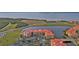 Aerial view of waterfront community with lush landscaping at 99 Vivante Blvd # 312, Punta Gorda, FL 33950