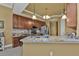 Modern kitchen with breakfast bar and stainless steel appliances at 99 Vivante Blvd # 312, Punta Gorda, FL 33950
