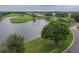 Aerial view of community landscape, golf course, and lake at 10494 Princess Ct, Punta Gorda, FL 33955