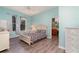 Spacious bedroom with light wood flooring and a dresser at 10494 Princess Ct, Punta Gorda, FL 33955