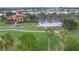 Community clubhouse with golf cart parking and surrounding landscape at 10494 Princess Ct, Punta Gorda, FL 33955