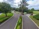 Gated community entrance with lush landscaping and guard house at 10494 Princess Ct, Punta Gorda, FL 33955